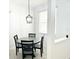 Bright breakfast nook with a modern chandelier, natural light, and stylish black chairs at 14315 Tree Swallow Way, Lakewood Ranch, FL 34202