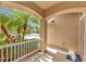 Inviting front porch with arched accents and lush landscaping, creating a charming and welcoming entrance to the home at 14315 Tree Swallow Way, Lakewood Ranch, FL 34202