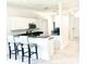 Clean kitchen with stainless steel appliances, granite countertops, and a breakfast bar at 14315 Tree Swallow Way, Lakewood Ranch, FL 34202