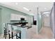 Well-designed kitchen with a breakfast bar, white cabinets, and an open layout, ideal for modern living and entertaining at 14315 Tree Swallow Way, Lakewood Ranch, FL 34202
