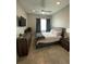 Well-lit bedroom featuring a queen-sized bed, modern furniture, and stylish decor at 1500 State St # 401, Sarasota, FL 34236