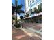 Picturesque urban street featuring modern apartments with artistic murals, palm trees and unique sidewalk appeal at 1500 State St # 401, Sarasota, FL 34236