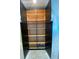 Open dark wood cabinet with multiple shelves providing ample storage space at 1500 State St # 401, Sarasota, FL 34236