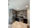 Modern kitchen featuring stainless steel appliances, granite countertops, and ample cabinet space at 1500 State St # 401, Sarasota, FL 34236
