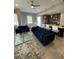 Open concept living area with stylish furniture, a dining space, and modern kitchen features at 1500 State St # 401, Sarasota, FL 34236