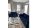 Cozy living room with stylish furniture, complemented by a dining area and large windows at 1500 State St # 401, Sarasota, FL 34236