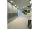 Apartment lobby featuring moss artwork, seating, and mailboxes at 1500 State St # 401, Sarasota, FL 34236