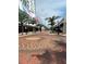 Urban street view of buildings featuring retail shops, dining establishments and lush palm trees at 1500 State St # 401, Sarasota, FL 34236