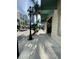 Quiet street view with lamp post and palm trees in a commercial area at 1500 State St # 401, Sarasota, FL 34236