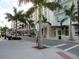 Scenic street view featuring a boutique shop-lined street with lush palm trees and sidewalk appeal at 1500 State St # 401, Sarasota, FL 34236