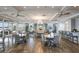 Beautiful clubhouse with tables, chairs and bar for entertaining guests in a spacious setting at 17418 Blue Ridge Pl, Lakewood Ranch, FL 34211