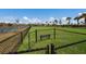 Grassy, fenced dog park with bench offers a pleasant outdoor area for pet owners and their dogs at 17418 Blue Ridge Pl, Lakewood Ranch, FL 34211