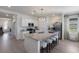 Modern kitchen boasts a spacious island with seating, stainless appliances, and a functional layout at 17418 Blue Ridge Pl, Lakewood Ranch, FL 34211