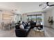 Bright and airy living room featuring an open floor plan, views of the pool, and comfortable seating at 17418 Blue Ridge Pl, Lakewood Ranch, FL 34211