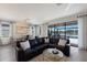 Spacious living room with large sectional sofa and views of the pool and lake at 17418 Blue Ridge Pl, Lakewood Ranch, FL 34211