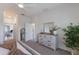 Inviting bedroom with a modern dresser and a view of the hallway at 17418 Blue Ridge Pl, Lakewood Ranch, FL 34211