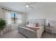 Bright bedroom featuring a cozy bed with soft linens and natural light at 17418 Blue Ridge Pl, Lakewood Ranch, FL 34211