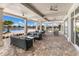 Covered patio offering stylish outdoor seating and views of a pool and landscaped area. Perfect for social gatherings at 17418 Blue Ridge Pl, Lakewood Ranch, FL 34211