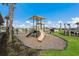 Community playground with slides and sunshades offer an outdoor area for to play and socialize at 17418 Blue Ridge Pl, Lakewood Ranch, FL 34211