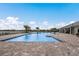 Resort-style pool featuring a sun deck, lounge chairs, and tropical landscaping, for relaxation and recreation at 17418 Blue Ridge Pl, Lakewood Ranch, FL 34211