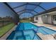A refreshing in-ground pool and spa offer a relaxing retreat in a screened enclosure with an outdoor entertainment area at 17418 Blue Ridge Pl, Lakewood Ranch, FL 34211