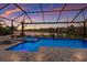 Gorgeous screened pool and spa with brick pavers offers serene water views and plenty of seating at 17418 Blue Ridge Pl, Lakewood Ranch, FL 34211