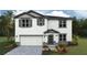 Charming two-story home with a two-car garage, neutral color palette, and well-maintained landscaping at 1742 Cobb Trl, Parrish, FL 34219