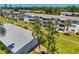 Aerial view of condominium complex featuring mature landscaping, screened-in porches, and walking paths at 2008 Canal Dr # M3, Bradenton, FL 34207