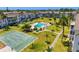 A high-angle shot showcasing the pool, shuffleboard court, and manicured grounds of this community at 2008 Canal Dr # M3, Bradenton, FL 34207