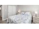 Cozy bedroom with marine-themed decor, spacious closet, and laminate wood flooring at 2008 Canal Dr # M3, Bradenton, FL 34207