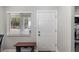 Neutral entryway featuring a bench seat and exterior access at 2008 Canal Dr # M3, Bradenton, FL 34207