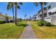 Well-maintained landscaping and walkway between buildings enhance this property's curb appeal at 2008 Canal Dr # M3, Bradenton, FL 34207