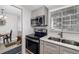 Updated kitchen features stainless steel appliances, granite countertops, and a double basin sink at 2008 Canal Dr # M3, Bradenton, FL 34207