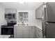 Well-lit kitchen featuring stainless steel appliances and modern cabinetry at 2008 Canal Dr # M3, Bradenton, FL 34207