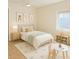 Charming bedroom featuring a comfortable bed, playful decor, and ample natural light from a large window at 22343 Lasalle Rd, Port Charlotte, FL 33952