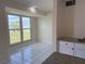 Dining room featuring white tile floors and large windows at 22343 Lasalle Rd, Port Charlotte, FL 33952