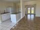 Open kitchen layout with tile flooring, breakfast bar, and modern appliances, creating an inviting atmosphere at 22343 Lasalle Rd, Port Charlotte, FL 33952