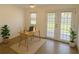 Bright office space with tiled floors, natural light, and double french doors leading to outdoor area at 22343 Lasalle Rd, Port Charlotte, FL 33952