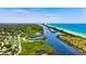 Gorgeous aerial view of the waterway from the Gulf to neighborhood at 248 Venice East Blvd, Venice, FL 34293