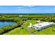 An exterior view of a building with kayaks lined up on the lawn at 248 Venice East Blvd, Venice, FL 34293