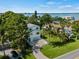 Beautiful two-story home with lush landscaping, mature trees, and stunning waterfront views at 3405 10Th W St, Palmetto, FL 34221