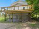 Outdoor space showcasing a balcony over a screened-in patio, with a lush fenced yard at 3405 10Th W St, Palmetto, FL 34221