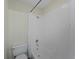 Bright bathroom featuring a standard white bathtub and shower combination with coordinated toilet at 3405 10Th W St, Palmetto, FL 34221