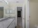 Bathroom with a granite countertop vanity and decorative lighting fixture above the mirror at 3405 10Th W St, Palmetto, FL 34221