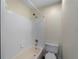 Clean bathroom featuring a shower-tub combination with white tile and neutral colored walls at 3405 10Th W St, Palmetto, FL 34221