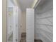 Hallway view featuring a well-organized closet and a full bathroom with a bathtub at 3405 10Th W St, Palmetto, FL 34221