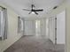 Spacious bedroom with a ceiling fan, a double door closet, and neutral carpet at 3405 10Th W St, Palmetto, FL 34221