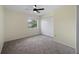 Comfortable bedroom with a window overlooking greenery and a double-door closet at 3405 10Th W St, Palmetto, FL 34221