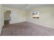 Neutral bedroom with bright windows and an open doorway at 3405 10Th W St, Palmetto, FL 34221