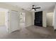 Spacious carpeted bedroom featuring a fireplace and ceiling fan at 3405 10Th W St, Palmetto, FL 34221